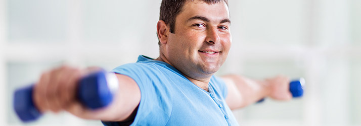 Chiropractic Huntsville AL Weight Loss Man Exercising With Weights Chiropractic Huntsville AL Weight Loss Man Exercising With Weights